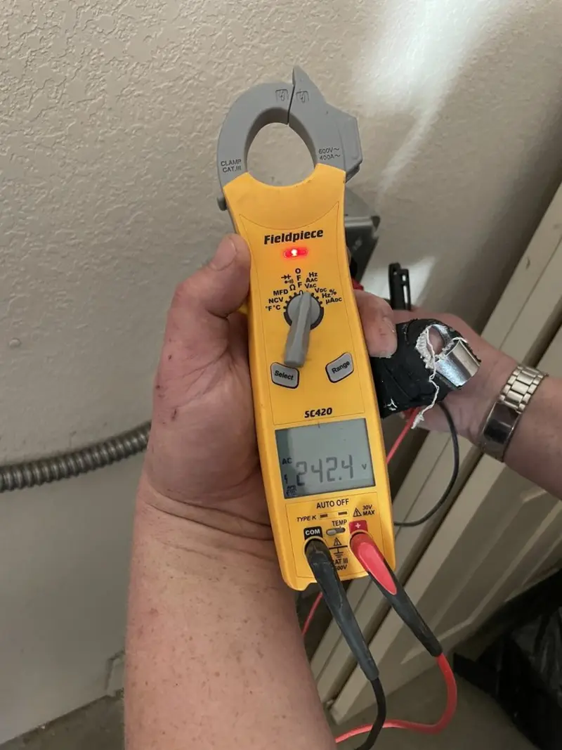 Voltage testing with clamp meter during Ceiling Fan Installation in Lake Butler
